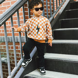 THE CHECKERED SPARK HOODIE - PUMPKIN